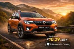 3rd generation Renault Duster SUV driving on mountain road with hybrid engine and 31 safety features starting at ₹10.29 lakh