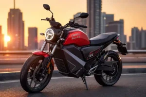 Oben Rorr EZ style red neo-retro electric motorcycle parked on a modern city street during golden hour with glowing round LED headlight and blurred skyline